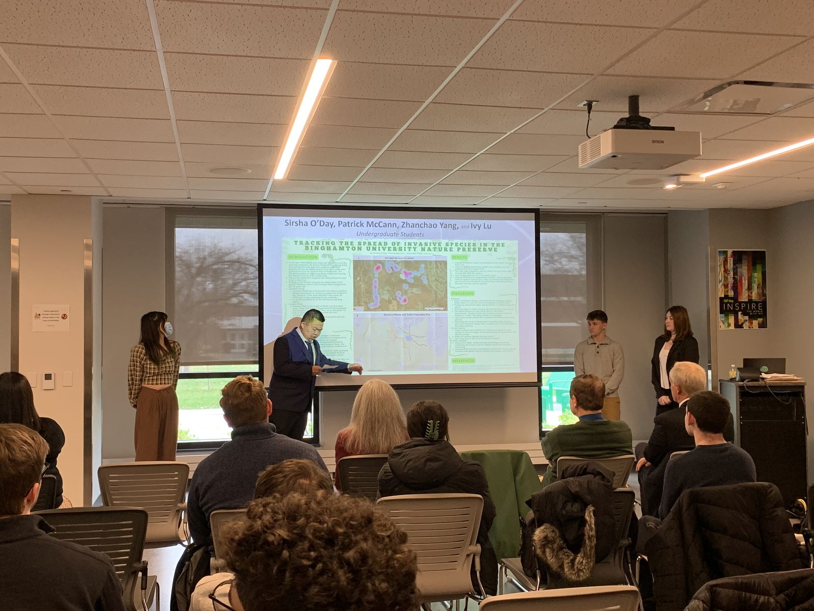 Zhanchao Yang and project team presenting the invasive species poster at Binghamton University GIS Day 2022