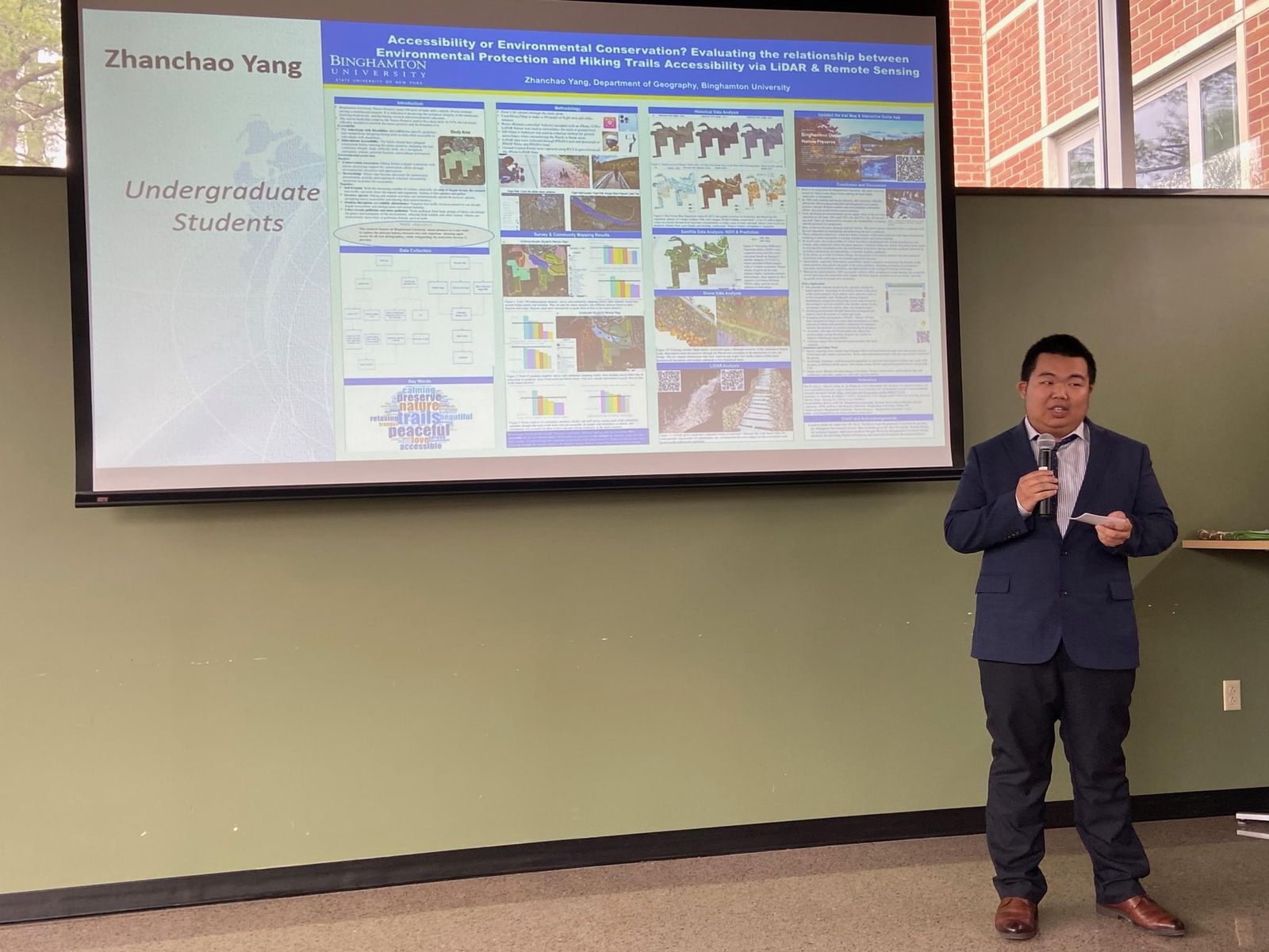 Zhanchao Yang presenting the poster Accessibility or Environmental Conservation? at Binghamton University GIS Day 2023