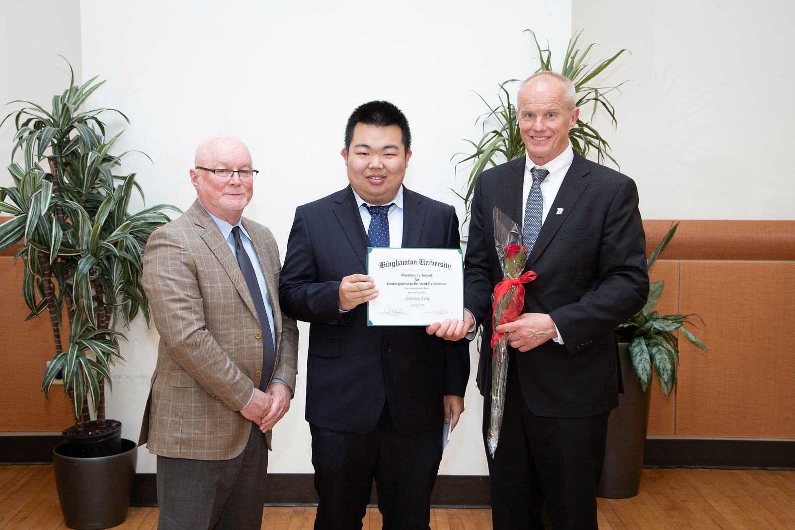 Zhanchao Yang receiving the President's Award for Undergraduate Student Excellence at Binghamton University, April 2024